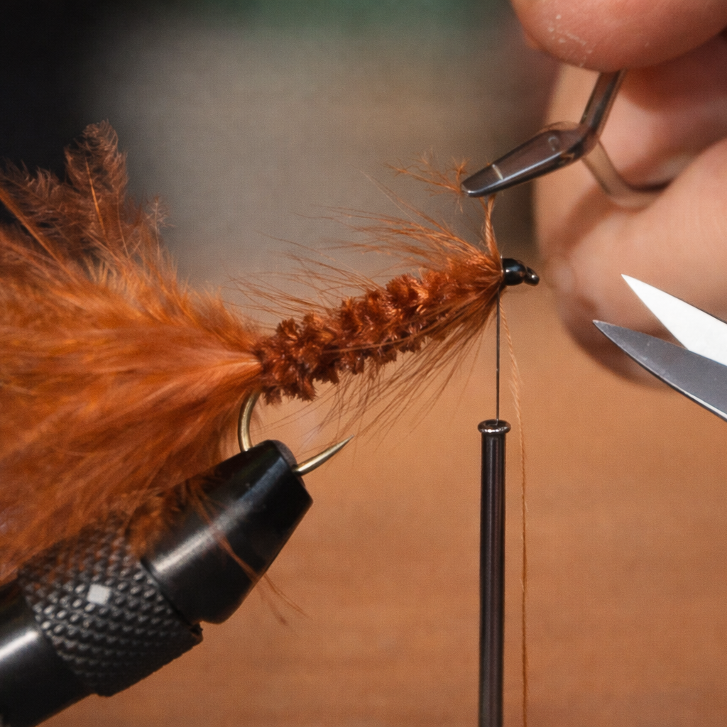 Close-Up of Fishing Fly Construction Adding Fur and Feathers to Create Realistic Lures